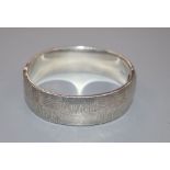 A modern textured silver bangle, Birmingham, 1971, 45 grams.CONDITION: Overall good condition.