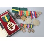 A WWII medal group (War, Defence and Burma Star) and a 1955 Territorial Efficiency medal (cased),