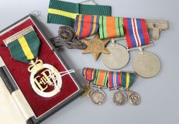 A WWII medal group (War, Defence and Burma Star) and a 1955 Territorial Efficiency medal (cased),