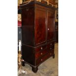 A George III mahogany hanging wardrobe (converted from a linen press) W.130cm, D.60cm, H.208cm