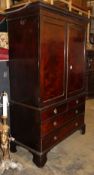 A George III mahogany hanging wardrobe (converted from a linen press) W.130cm, D.60cm, H.208cm