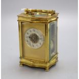 A brass cased carriage clock, height 14cm with handle down