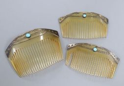 An early 20th century Art Nouveau graduated set of three sterling and turquoise cabochon set horn