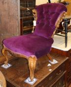 A Victorian carved walnut buttoned salon chair