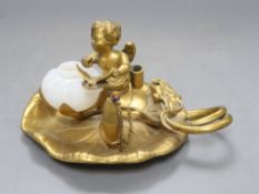 A Victorian ormolu 'cherub' inkstand, length 20cmCONDITION: Did not have a lid, the cherub's body