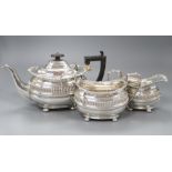 An Edwardian silver three piece tea set by Nathan & Hayes, Chester, 1904/5/6, gross 38.5 oz.