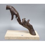 A modern American limited edition bronzed 'hand' sculpture on a hardstone base, signed Lorenzo
