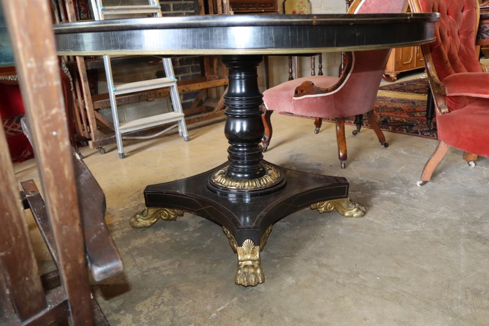 A George IV rosewood and ebony gilt metal mounted circular breakfast table, on cast lion paws - Image 2 of 2