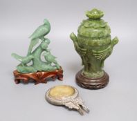 A Chinese green carved hardstone lidded jar, a carved bird group and a plated mirror, tallest 24cm