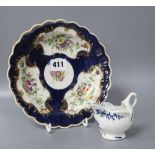 An 18th century Worcester blue scale plate, diameter 19.5cm and a sauceboat