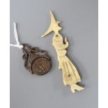 A novelty bone witch and broomstick and an early cut steel swivel fob