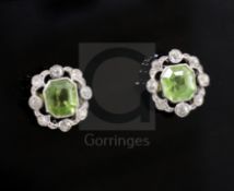 A pair of mid 20th century white gold, peridot and diamond cluster set earstuds, of pierced shaped