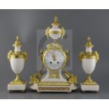 A Louis XVI style ormolu mounted white marble clock garniture, decorated with goat's head motifs,