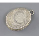 A Victorian engraved silver oval vinaigrette, by Aston & Son, decorated with flowers and scrolls,