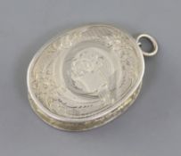 A Victorian engraved silver oval vinaigrette, by Aston & Son, decorated with flowers and scrolls,