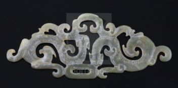 A Chinese Western Zhou style jade plaque, carved and pierced with two entwined chilong