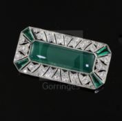 An Art Deco platinum?, chrysophase, SYNTHETIC?emerald and diamond millegrain set octagonal brooch