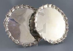 A pair of George II silver shaped circular salvers by John Tuite, with scroll and shell borders,