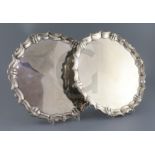 A pair of George II silver shaped circular salvers by John Tuite, with scroll and shell borders,