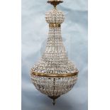 A pair of Empire style cut glass beaded and bronzed metal bag chandeliers, drop 3ft 9in. diam. 1ft