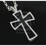 A modern Theo Fennell 18ct white gold and diamond set openwork cross pendant, on a Theo Fennell 18ct