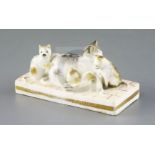 A rare Rockingham group of a cat and three kittens, c.1830, on a 'tiled' floor base, unmarked, L.