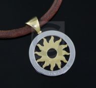 A 20th century Italian 18ct gold and steel Bulgari pendant, on a fabric necklet with Bulgari