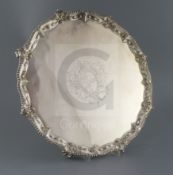 An early George III silver shaped circular salver by Ebenezer Coker, with gadrooned and scroll
