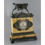 A Charles X French bronze and Sienna marble mantel clock, surmounted with the figure of a