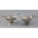 A pair of Victorian pierced silver boat shaped pedestal dishes, maker G.F.?, with swag and roundel