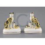 A rare pair of Staffordshire porcelain groups of a cat and a kitten, c.1835-50, H. 7.5 and 7.