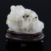 A Chinese pale celadon jade figure of a lion dog and cub, 18th/19th century, the stone of good