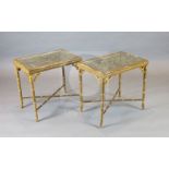 A pair of 20th century lacquered gilt faux bamboo occasional tables, inset with glazed, carved and