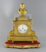 A 19th century French ormolu mantel clock, surmounted with a bust of Shakespeare, surmounted with