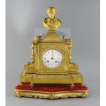 A 19th century French ormolu mantel clock, surmounted with a bust of Shakespeare, surmounted with