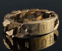 A 1970's heavy textured 9ct gold curblink identity bracelet, engraved with the letters F.D.P,