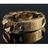 A 1970's heavy textured 9ct gold curblink identity bracelet, engraved with the letters F.D.P,