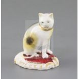 A rare Rockingham porcelain figure of a seated cat, c.1830, incised ' No. 77 1 fig.', red 'CL2',