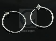 A modern pair of Italian Gavello 18ct white gold and five stone gypsy set diamond hoop earrings,