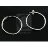 A modern pair of Italian Gavello 18ct white gold and five stone gypsy set diamond hoop earrings,