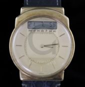 A gentleman's 14ct gold Junghans Mega digital and analogue quartz wrist watch, on Mega strap.