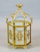 A Victorian style ormolu hall lantern, with foliate scroll and ivy leaf frame, inset with frosted