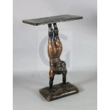 A 20th century carved and painted wood occasional table, with faux marble top, blackamoor acrobat