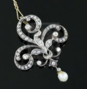 A late Victorian gold and silver, diamond and drop pearl set openwork scroll pendant brooch, 43mm,