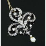 A late Victorian gold and silver, diamond and drop pearl set openwork scroll pendant brooch, 43mm,