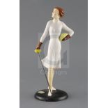 A rare Goebel Art Deco pottery figure of female fencer, holding a foil in her right hand,