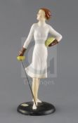 A rare Goebel Art Deco pottery figure of female fencer, holding a foil in her right hand,