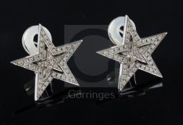 A modern pair of Theo Fennell 18ct white gold and diamond chip encrusted pierced double star