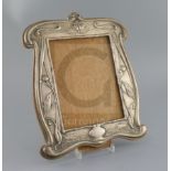 An Edwardian Art Nouveau repousse silver mounted photograph frame by William Neale, Birmingham,