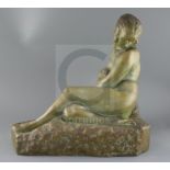 Marcel Bouraine (1886-1948). A French bronzed terracotta figure of a reclining woman, signed,